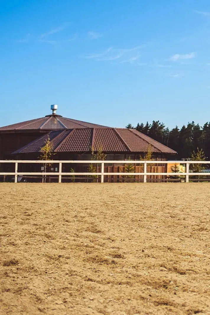 Arena Footing West Ranch 01 an Arena Footing with a ranch in the back